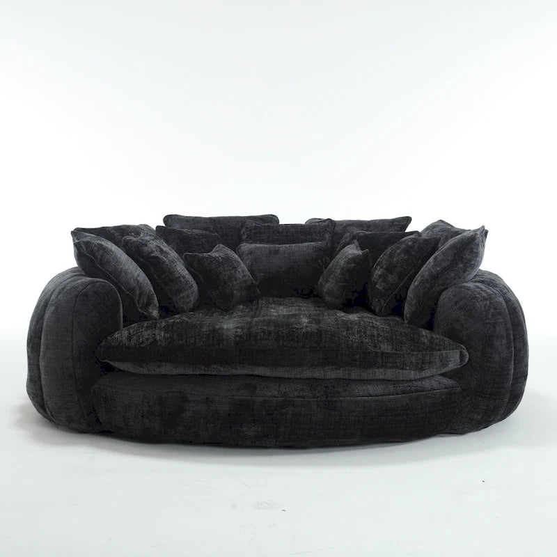 Beiges, übergroßes rundes Schlafsofa aus Chenille, hohe Rückenlehne, umlaufende Sitzfläche, mit Kissen